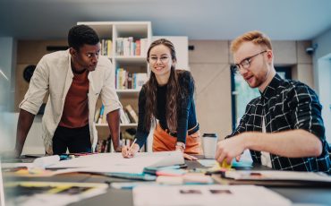 diverse-coworkers-planning-project-in-office